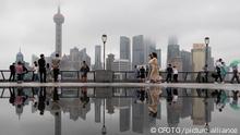 SHANGHAI, CHINA - SEPTEMBER 13, 2022 - Tourists visit the Bund on a rainy day in Shanghai, China, Sept 13, 2022. Due to Typhoon Muifa, the rain in Shanghai was not heavy, but it will continue until Sunday.
