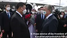 Chinese President Xi Jinping is welcomed by Kazakh President Kassym-Jomart Tokayev upon his arrival in Nur-Sultan, Kazakhstan September 14, 2022. Press service of the President of Kazakhstan/Handout via REUTERS ATTENTION EDITORS - THIS IMAGE HAS BEEN SUPPLIED BY A THIRD PARTY. MANDATORY CREDIT.
