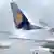 A Lufthansa plane being de-iced