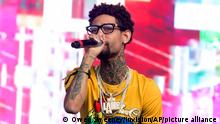 FILE - Philadelphia rapper PnB Rock performs at the 2018 Firefly Music Festival in Dover, Del., on June 16, 2018. The rapper, whose real name is Rakim Allen, was fatally shot during a robbery in South Los Angeles on Monday, Sept. 12, 2022. He is best known for his 2016 hit “Selfish.” He released his latest song, “Luv Me Again,” on Sept. 2. (Photo by Owen Sweeney/Invision/AP, File)