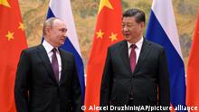 FILE - Chinese President Xi Jinping, right, and Russian President Vladimir Putin talk during their meeting in Beijing, China, Friday, Feb. 4, 2022. With Russia’s military failings in Ukraine mounting, no country is paying closer attention than China to how a smaller, outgunned force has badly bloodied what was thought to be one of the world’s strongest armies. (Alexei Druzhinin, Sputnik, Kremlin Pool Photo via AP, File)