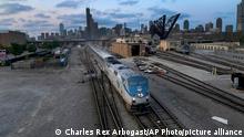 An Amtrak passenger train departs Chicago in the early evening headed south Wednesday, Sept. 14, 2022, in Chicago. Business and government officials are preparing for a potential nationwide rail strike at the end of this week, that could also affect local and national passenger trains, while talks carry on between the largest U.S. freight railroads and their unions. (AP Photo/Charles Rex Arbogast)