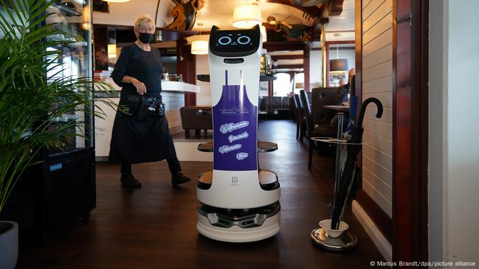 Serving robot Bella with a waitress