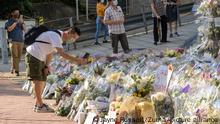 September 15, 2022, Hong Kong, Hong Kong, China: At dawn on the 7th day since Queen Elizabeth II passed, flowers over the pavement outside the British Consulate in Admiralty, Hong Kong. Hong Kong, once a British Colony, has been handed back to China with sedition a crime under the new regime. As flowers and messages increase, so to do references to the Golden Era of British Rule. Such messages could be seen as seditious. (Credit Image: Â© Jayne Russell/ZUMA Press Wire