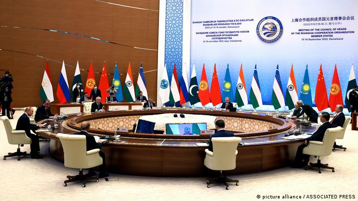 Regional leaders sit around a large table at the Shanghai Cooperation Organization (SCO) summit in Uzbekistan on September 16, 2022
