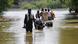 A man pulls his animals while others go to salvage their belongings amid rising flood water, following rains and floods during the monsoon season on the outskirts of Bhan Syedabad, Pakistan A man pulls his animals while others go to salvage their belongings amid rising flood water, following rains and floods during the monsoon season on the outskirts of Bhan Syedabad, Pakistan
