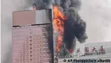 In this image taken from video, massive fire and plumes of smoke rise from a skyscraper Friday, Sept. 16, 2022, Changsha, Hunan province, China. The 42-storied building of more than 200-meter tall (656-foot) housed an office of state-owned telecommunications company China Telecom. No casualties were reported, officials said. (AP Photo)