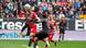 Augsburg's Andre Hahn heads the ball while Bayern Munich's Sadio Mane and Jamal Musiala try to stop him. Augsburg's Andre Hahn heads the ball while Bayern Munich's Sadio Mane and Jamal Musiala try to stop him.