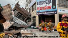18.09.2022 This photo provided by Hualien County fire department show firefighters in the search for trapped victims in a collapsed residential building following earthquake in Yuli township in Hualien County, eastern Taiwan, Sunday, Sept. 18, 2022. A strong earthquake shook much of Taiwan on Sunday, toppling at least one building and trapping two people inside and knocking part of a passenger train off its tracks at a station.(Hualien County Fire Department via AP)
