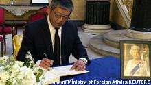 Kelly Hsieh, Taiwan's representative in London, signs the condolence book for Britain's Queen Elizabeth at Lancaster House in London, Britain, in this undated handout image released September 18, 2022. Taiwan Ministry of Foreign Affairs/Handout via REUTERS ATTENTION EDITORS - THIS IMAGE WAS PROVIDED BY A THIRD PARTY. NO RESALES. NO ARCHIVES.