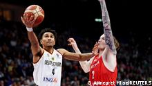 Basketball - EuroBasket Championship - Third Place Playoff - Germany v Poland - Mercedes-Benz Arena, Berlin, Germany - September 18, 2022 Germany's Maodo Lo in action with Poland's Aleksander Balcerowski REUTERS/Annegret Hilse