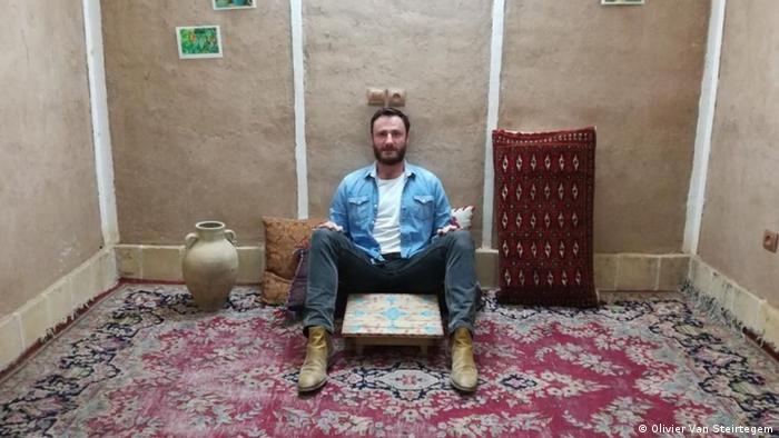 Olivier Vandecasteele is seen laughing in a room in Iran.