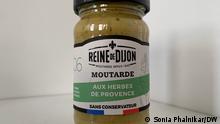A jar of Reine de Dijon mustard