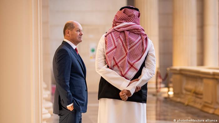 German Chancellor Olaf Scholz with a Saudi official at the G20 finance ministers summit in Riyadh, Saudi Arabia in February 2020