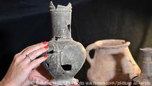 20.9.2022, Jerusalem****
Eriola Jakoel picks up a pottery vessel, unearthed in an excavation in Tel Yehud, with opium residue dating back to the 14th century BC, in Israel Antiquities Authority lab in Jerusalem, on September 20, 2022. A joint study by the Israel Antiquities Authority, Tel Aviv University and the Weizmann Institute of Science reveals the world's earlier evident of opium use by the Canaanites as an offering for the dead. Photo by Debbie Hill UPI Photo via Newscom picture alliance