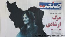 A newspaper with a cover picture of Mahsa Amini, a woman who died after being arrested by the Islamic republic's morality police is seen in Tehran, Iran September 18, 2022. Majid Asgaripour/WANA (West Asia News Agency) via REUTERS ATTENTION EDITORS - THIS IMAGE HAS BEEN SUPPLIED BY A THIRD PARTY.