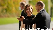 German Chancellor Olaf Scholz, right, welcomes the President of Moldova Maia Sandu for a meeting at the chancellery in Berlin, Friday, Sept. 23, 2022. (AP Photo/Markus Schreiber)