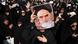 Women in black hold a photo of the late Ayatollah Khomeini Women in black hold a photo of the late Ayatollah Khomeini