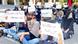 Women in Iran sat in protest holding up signs Women in Iran sat in protest holding up signs