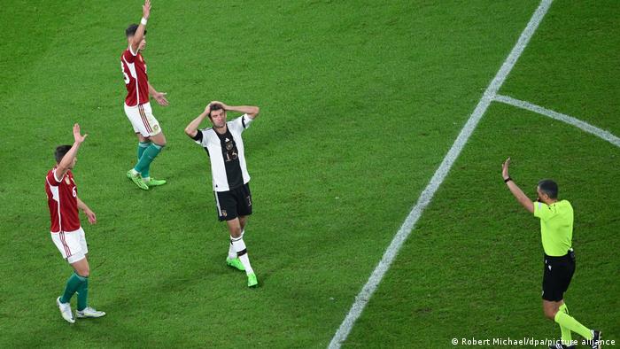 Germany's Thomas Müller has his head in his hands after a missed chance against Hungary.