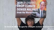 IMAGE DISTRIBUTED FOR GLASGOW ACTIONS TEAM - Activists from Glasgow Actions Team, Friends of the Earth US, and Big Shift Global protest at the World Bank headquarters in Washington on Thursday, Sept. 22, 2022 calling for world leaders to fire Bank President David Malpass after statements casting doubt on climate change. (Kevin Wolf/AP Images for Glasgow Actions Team)