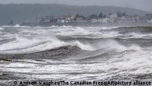 Waves pound the shore in Eastern Passage, N.S. on Saturday, Sept. 24, 2022. Strong rains and winds lashed the Atlantic Canada region as Fiona closed in early Saturday as a big, powerful post-tropical cyclone, and Canadian forecasters warned it could be one of the most severe storms in the country's history. (Andrew Vaughan /The Canadian Press via AP)