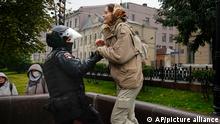 A Police officer detains a demonstrator during a protest against a partial mobilization in Moscow, Russia, Saturday, Sept. 24, 2022. (AP Photo)