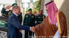 In this photo released by Saudi Press Agency, SPA, Saudi Crown Prince Mohammed bin Salman, right, shakes hands with Chancellor Olaf Scholz, after his arrival in Jeddah, Saudi Arabia, Saturday, Sept 24, 2022. (Saudi Press Agency via AP)