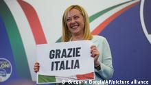 26.09.2022 Far-Right party Brothers of Italy's leader Giorgia Meloni shows a placard reading in Italian Thank you Italy at her party's electoral headquarters in Rome, Sunday, Sept. 25, 2022. Italians voted in a national election that might yield the nation's first government led by the far right since the end of World War II. (AP Photo/Gregorio Borgia)