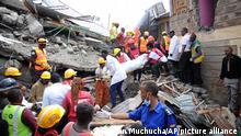 Rescurers search through a multi-storey collapsed apartment building in Kirigiti, Kiambu County, Kenya, Monday, Sept. 26, 2022. Rescuers are picking through the debris in search of several people reported missing. (AP Photo/John Muchucha)