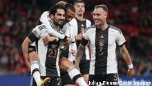 LONDON, ENGLAND - SEPTEMBER 26: Ilkay Guendogan of Germany celebrates with teammates Leroy Sane and David Raum after scoring their side's first goal from the penalty spot during the UEFA Nations League League A Group 3 match between England and Germany at Wembley Stadium on September 26, 2022 in London, England. (Photo by Julian Finney/Getty Images)