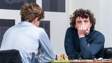 Chess grandmaster Hans Niemann looks to the distance while playing world champion Magnus Carlsen 