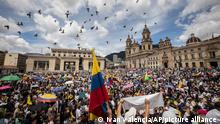 Thousands of protesters protest against the tax reform and other initiatives of President Gustavo Petro's government at the Bolivar square in downtown Bogota, Colombia, Monday, Sept. 26, 2022. (AP Photo/Ivan Valencia)