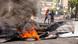 A burning tire in the street of Port-au-Prince A burning tire in the street of Port-au-Prince