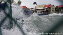 Waves crash against a seawall as Hurricane Ian passes through George Town, Grand Cayman island, Monday, Sept. 26, 2022. (AP Photo/Kevin Morales)