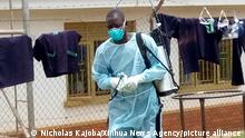 25.9.2022, Mubende, Uganda, -- MUBENDE, Sept. 25, 2022 (Xinhua) -- A medical worker is seen after disinfecting a demarcated Ebola treatment center at the Mubende Regional Hospital in Mubende District, Uganda, Sept. 21, 2022. Uganda's Ministry of Health said it has registered four more cases of the deadly Ebola virus, bringing the country's total number of confirmed cases to 15. (Photo by Nicholas Kajoba/Xinhua)