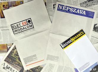 Three Hungarian newspapers and magazines are arranged with their front-pages published blank