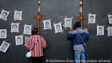 September 26, 2022, Mexico, Mexico: Protesters look through the fences during a demonstration to commemorate the 8th anniversary of the disappearance of the 43 Ayotzinapa students. On the night of September 26, 2014, 43 students from the RaÅl Isidro Burgos Rural Normal School located in Iguala, Guerrero, were victims of forced disappearance by members of public security from the state of Guerrero and federal military security..The students had allegedly tried to hijack trucks to use for their protests. (Credit Image: © Guillermo Diaz/SOPA Images via ZUMA Press Wire