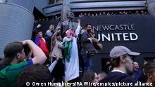 Newcastle United takeover. Newcastle United fans celebrate at St James' Park following the announcement that The Saudi-led takeover of Newcastle has been approved. Picture date: Thursday October 7, 2021. See PA story SOCCER Newcastle. Photo credit should read: Owen Humphreys/PA Wire. RESTRICTIONS: Use subject to restrictions. Editorial use only, no commercial use without prior consent from rights holder. URN:62927262
