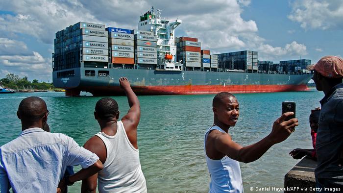 Men wait at Dar es Salaam Port in Tanzania