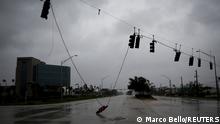 A fallen traffic light is seen in a street as Hurricane Ian makes landfall in southwestern Florida, in Fort Myers, Florida, U.S. September 28, 2022. REUTERS/Marco Bello 