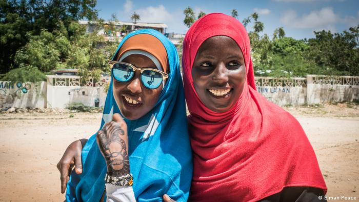 Two of Elman Peace’s young war survivors in Somalia being assisted by the Elman Peace nonprofit.