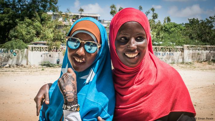 Two of Elman Peace’s young war survivors in Somalia being assisted by the Elman Peace nonprofit.