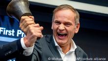 CEO of Porsche car maker Oliver Blume rings the bell during the start of Porsche's market listing at the stock market in Frankfurt, Germany, Thursday, Sept. 29, 2022. (AP Photo/Michael Probst)