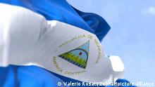 Detail of the national flag of Nicaragua waving in the wind on a clear day. Nicaragua is the largest country in the Central American isthmus. Selective focus.