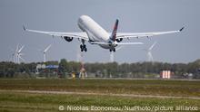 Delta Air Lines Airbus A330-300 aircraft as seen flying over wind turbines while departing from Amsterdam Schiphol Airport AMS EHAM. The wide body A330 airplane has the registration N801NW. The commercial jet is taking off and flying to Seattle SEA, USA as flight DL143. Delta Airlines is the second-largest airline carrier in the world, member of SkyTeam aviation alliance group with a fleet of 869 planes. The aviation industry is facing an increased demand as passenger want to fly as the Covid-19 Coronavirus Pandemic measures have been lifted or reduced globally. Amsterdam, The Netherlands on May 4, 2022 (Photo by Nicolas Economou/NurPhoto)