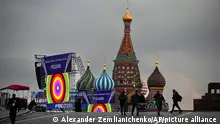 Police officers walk at Red Square in front of constructions reading the words ''Donetsk, Luhansk, Zaporizhzhia, Kherson, Russia'', with the St. Basil's Cathedral and Lenin Mausoleum in the background, ahead of a planned concert in Moscow, Russia, Thursday, Sept. 29, 2022. The Kremlin said that Russian President Vladimir Putin and the leaders of the four regions of Ukraine that held a referendum on joining Russia will attend a ceremony to sign documents on the regions' incorporation into Russia, which will be followed by a big concert on Red Square. (AP Photo/Alexander Zemlianichenko)