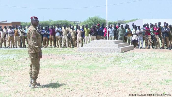 President Paul-Henri Damiba stands in front of soldiers in Djibo