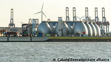Gas storage reservoir, wind turbines and cranes in the harbour area in Hamburg, Germany