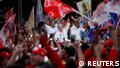 Brazil's former president and candidate for the presidential election Luiz Inacio Lula da Silva greets supporters